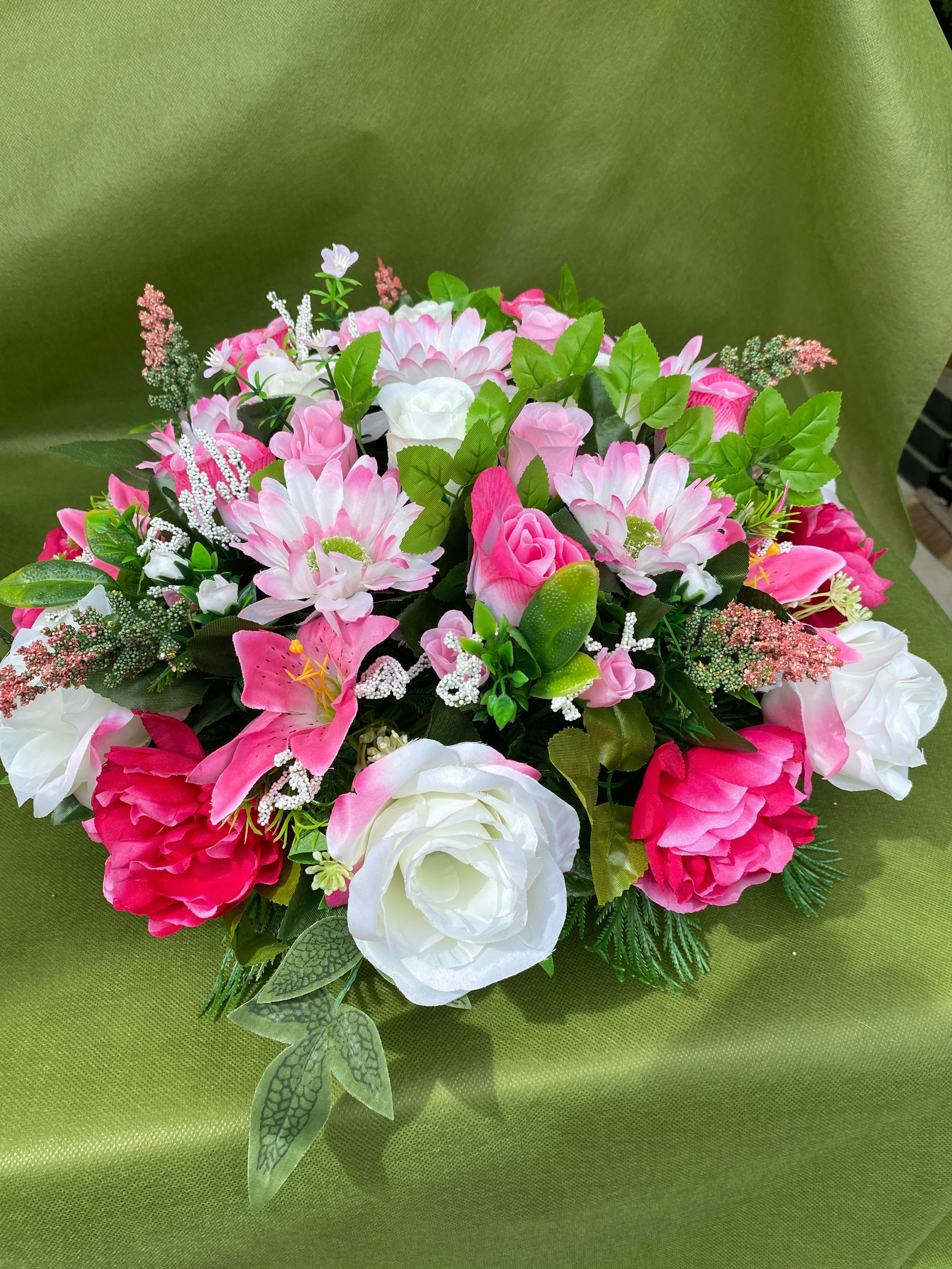 Artificial red and white funeral wreath memorial tribute